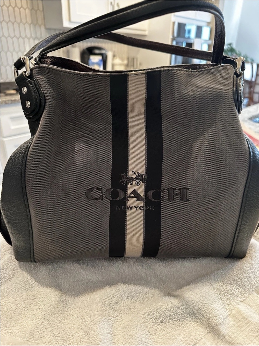 Coach Edie 31 black and silver Horse & Carriage Signature